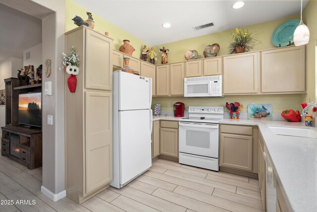 15790 W Arrowhead Dr, Surprise, AZ 85374 - kitchen with white appliances, light countertops, wood tiled floors, and recessed lighting