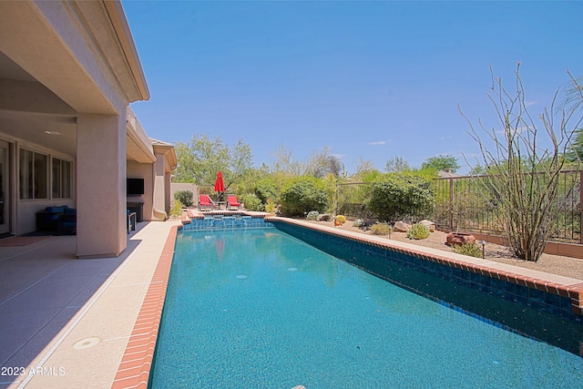 view of swimming pool featuring a patio area