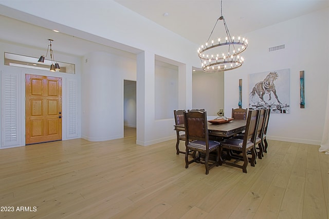 dining room featuring a chandelier and light hardwood / wood-style floors