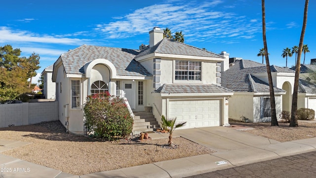 view of front of property with a garage