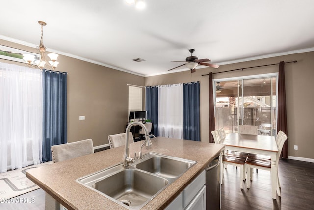 kitchen featuring ceiling fan with notable chandelier, dishwasher, sink, hanging light fixtures, and ornamental molding