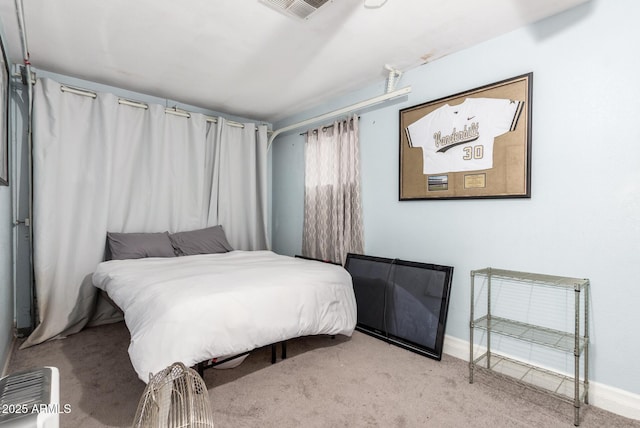 bedroom with light colored carpet