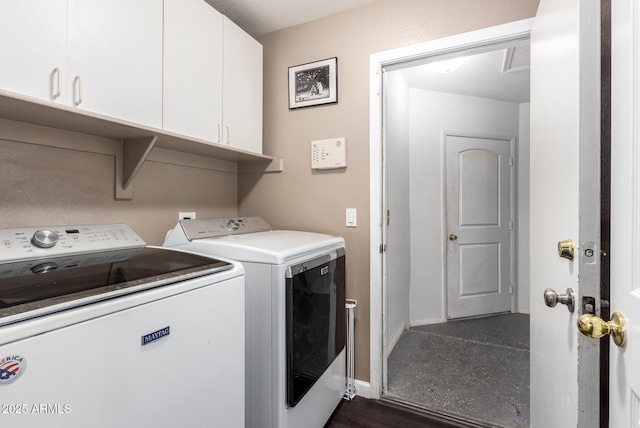 washroom with cabinets and separate washer and dryer