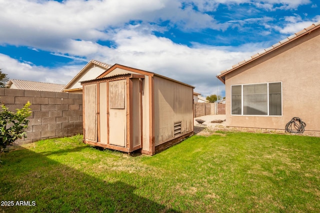 view of outdoor structure featuring a yard