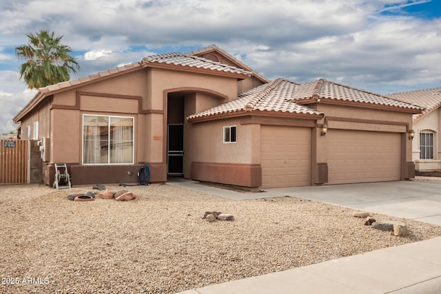 mediterranean / spanish-style house featuring a garage