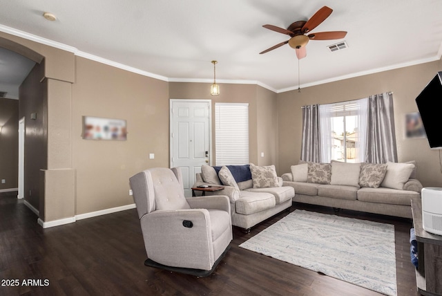 living room featuring crown molding, ceiling fan, and dark hardwood / wood-style floors