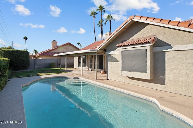 view of swimming pool featuring a patio area