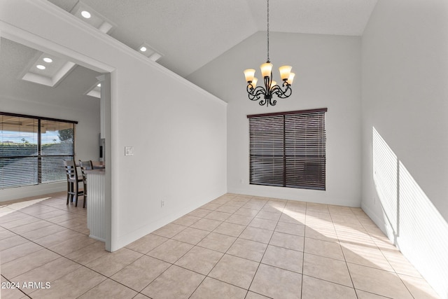 unfurnished dining area featuring high vaulted ceiling, a notable chandelier, and light tile patterned flooring