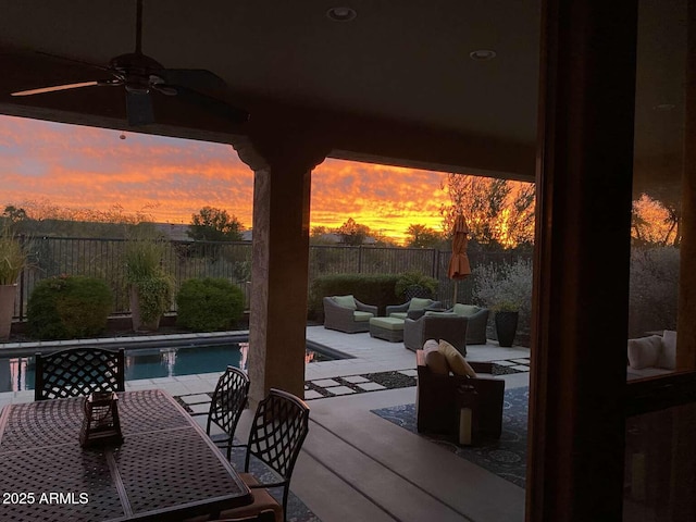 view of patio / terrace featuring ceiling fan, outdoor dining area, an outdoor hangout area, and a fenced backyard