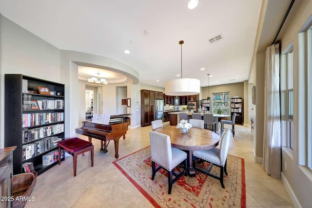 dining room featuring visible vents, recessed lighting, light tile patterned flooring, and a notable chandelier