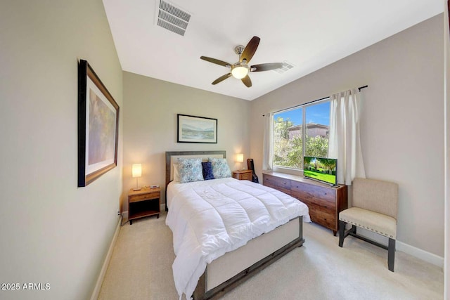 bedroom with baseboards, ceiling fan, light carpet, and visible vents