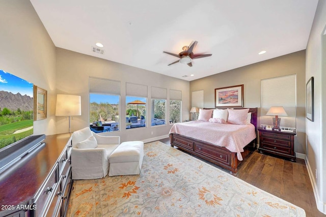 bedroom featuring visible vents, wood finished floors, baseboards, ceiling fan, and recessed lighting