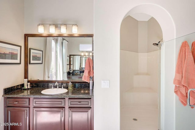bathroom featuring vanity and walk in shower