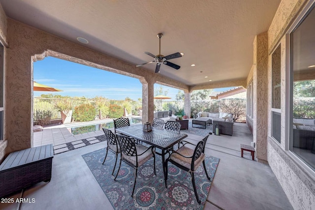 view of patio with ceiling fan and an outdoor living space