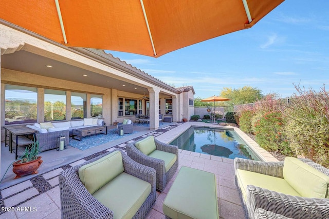 view of swimming pool featuring an outdoor hangout area, a fenced in pool, a patio, and a fenced backyard