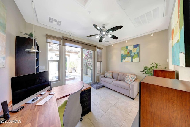office featuring visible vents, rail lighting, ceiling fan, and light tile patterned floors