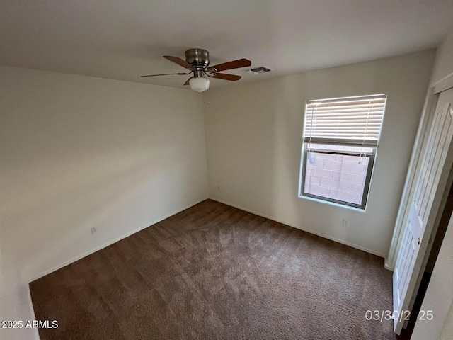 unfurnished bedroom featuring a ceiling fan, visible vents, and carpet