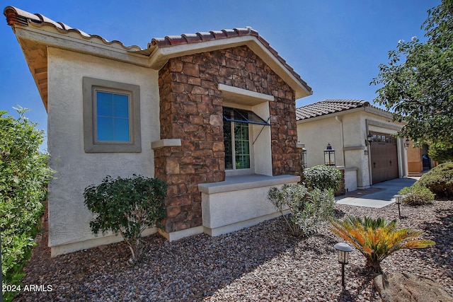 mediterranean / spanish house featuring a garage