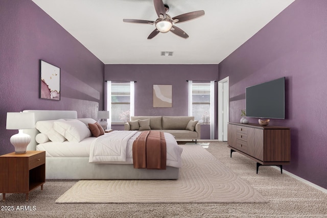 bedroom featuring visible vents, carpet floors, baseboards, and ceiling fan