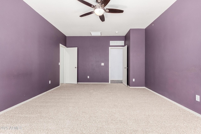 unfurnished bedroom featuring carpet flooring, visible vents, baseboards, and ceiling fan