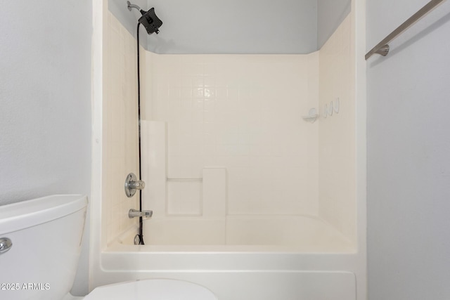 bathroom featuring toilet and shower / bath combination