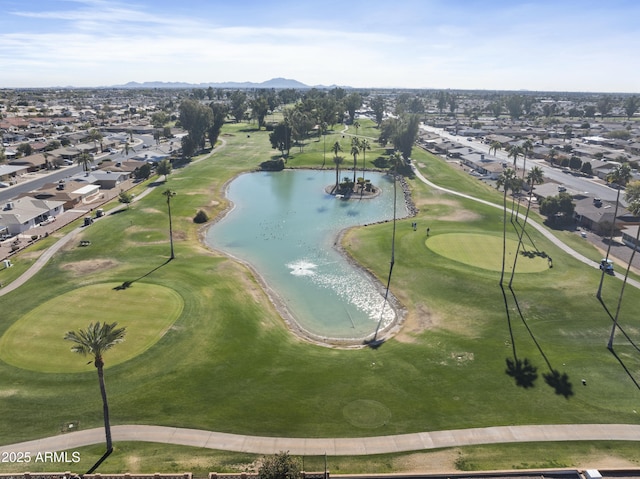 bird's eye view with view of golf course and a water view