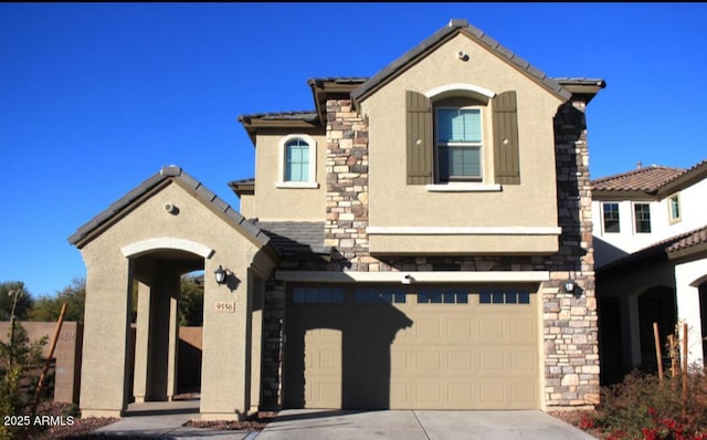 mediterranean / spanish-style home featuring a garage