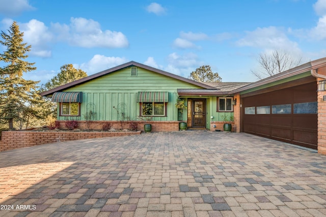 single story home with a garage