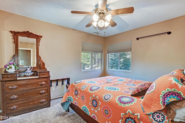 bedroom with ceiling fan and carpet flooring