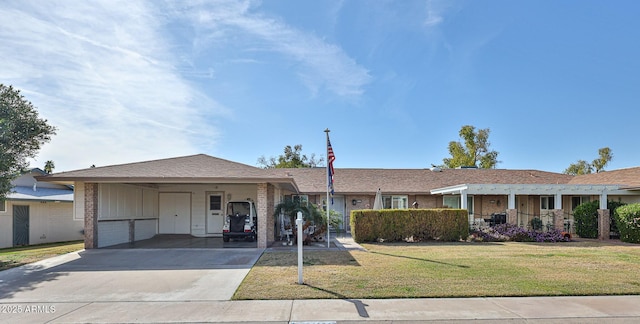 ranch-style home with an attached carport, driveway, and a front lawn