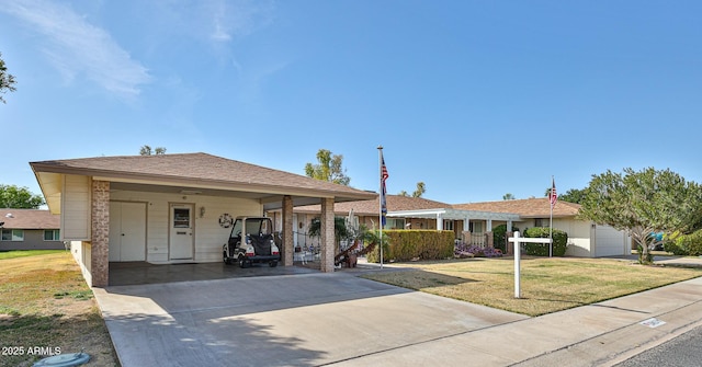 ranch-style house with driveway and a front yard