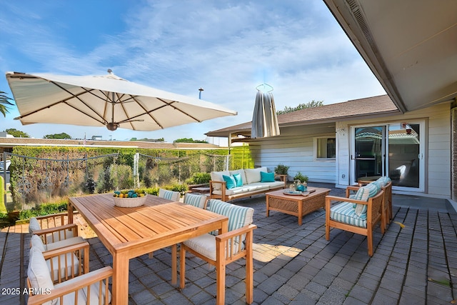 view of patio / terrace featuring outdoor dining area and an outdoor living space