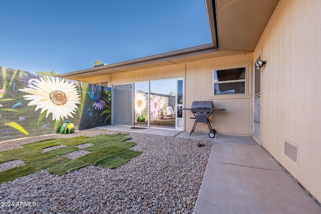 back of house with a patio