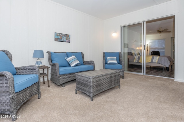 living room featuring light colored carpet and ornamental molding