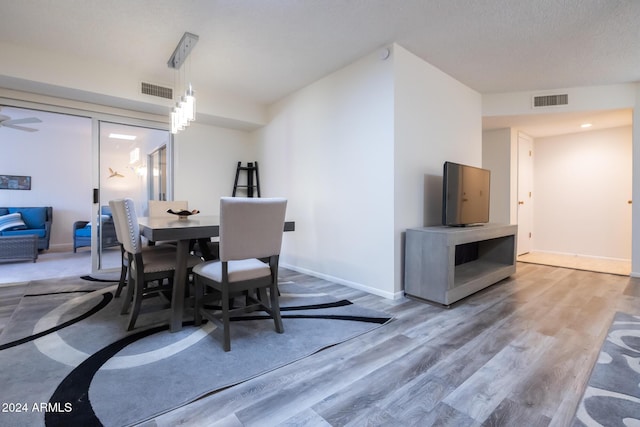 dining area with wood-type flooring