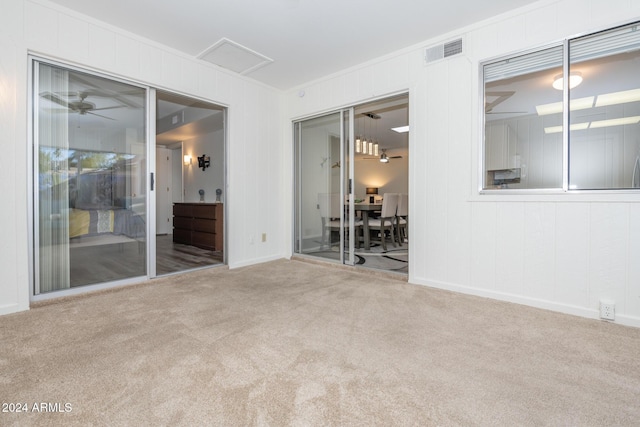 carpeted empty room with ceiling fan