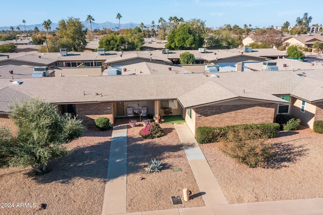 birds eye view of property with a mountain view