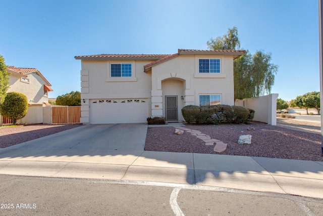 mediterranean / spanish house featuring a garage