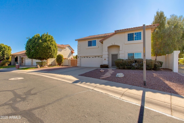 mediterranean / spanish-style home featuring a garage