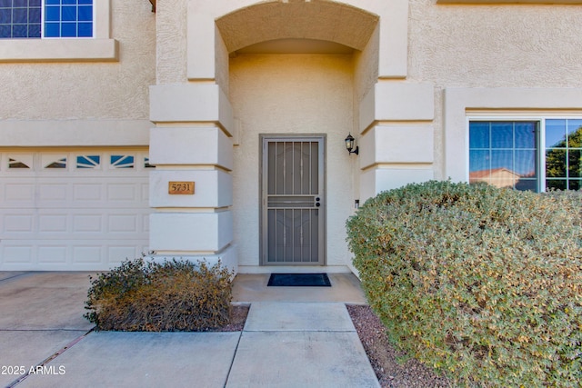 property entrance with a garage