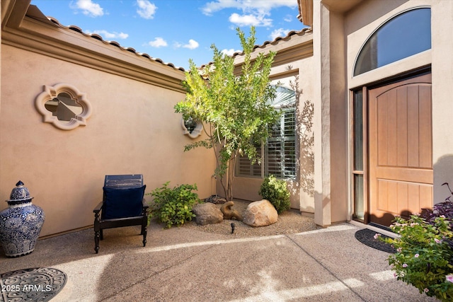 property entrance with a patio area