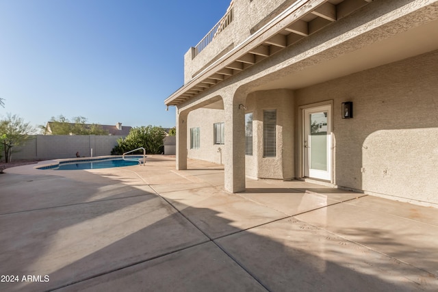 view of patio / terrace featuring a fenced in pool