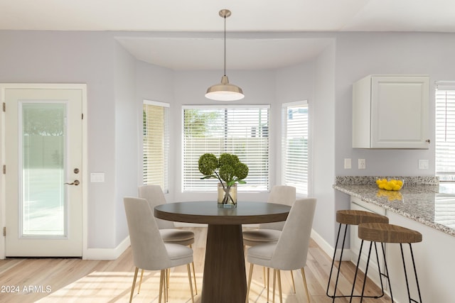 dining space featuring light wood-type flooring