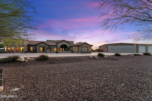 mediterranean / spanish-style house featuring a garage