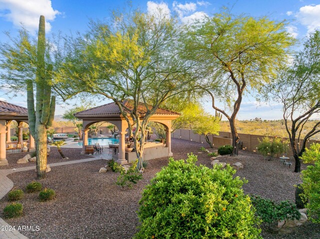 view of yard with a community pool, a patio area, and a gazebo