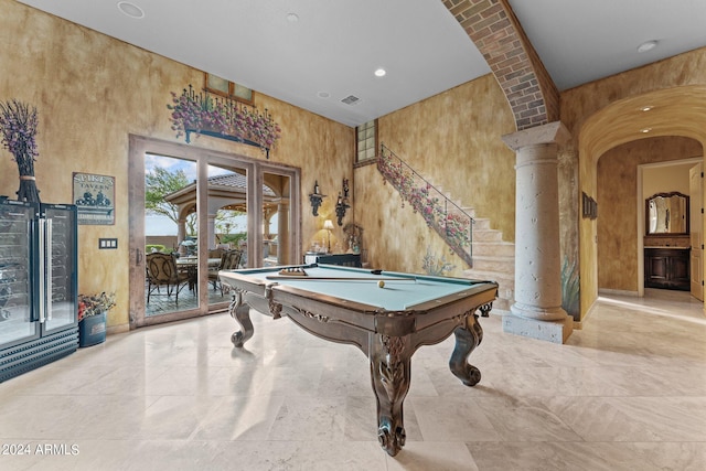 recreation room featuring light tile floors, billiards, wood walls, decorative columns, and french doors