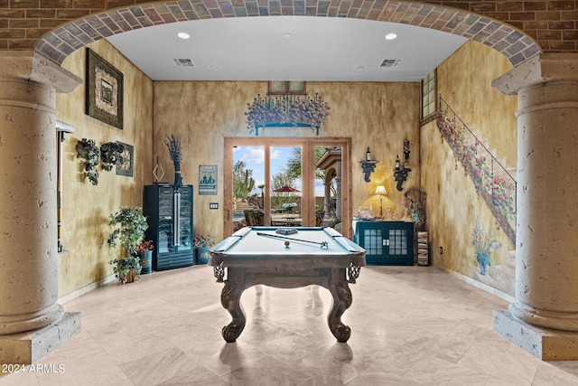 recreation room featuring light tile flooring, wooden walls, and pool table