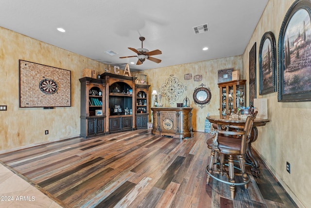 interior space featuring ceiling fan and tile floors