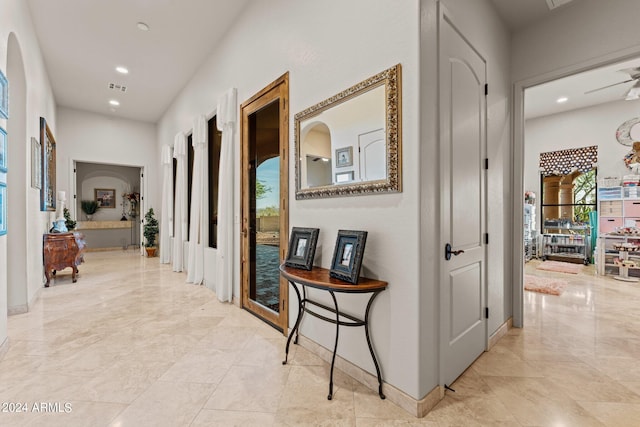 corridor featuring light tile floors