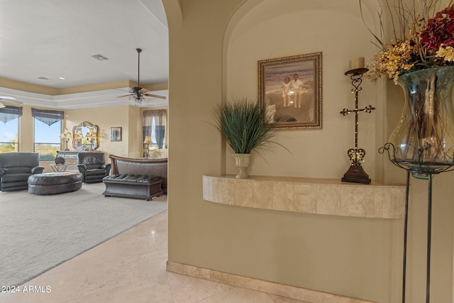 living room featuring ceiling fan and tile floors